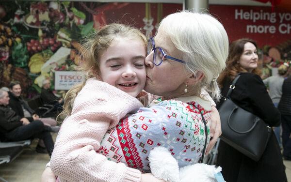 Anne Cooney from Athlone, Co. Westmeath, greets her six-year-old granddaughter Jessicain Dublin Aiport arrivals. Photo: Gareth Chaney/Collins