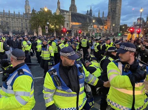 Gathering near Parliament Square, the group threw projectiles and insulted officers