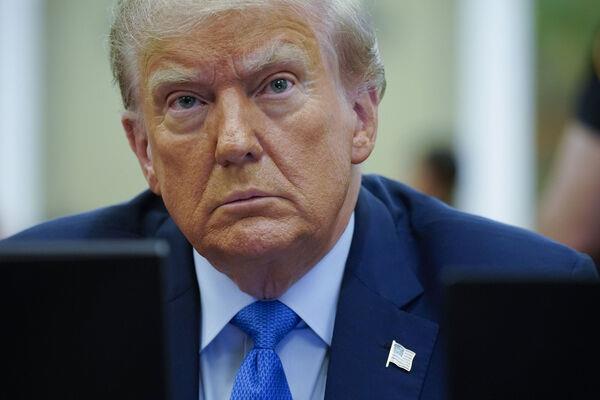 People protest against former President Donald Trump outside the New York Supreme Court, Monday, Nov. 6, 2023, in New York. (AP Photo/Stefan Jeremiah)