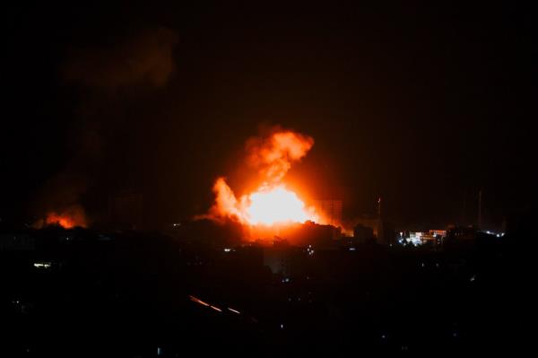 Flames and smoke billow during Israeli strikes in Gaza, October 9, 2023. 